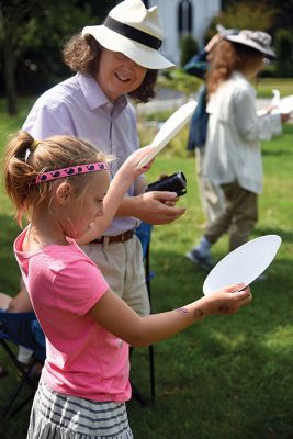 Partial Eclipse, Total Excitement 
The Plumb Library welcomed celestial spectators on Monday for the region’s partial eclipse of the sun, handing out free eclipse glasses. Photos by Glenn C. Silva
