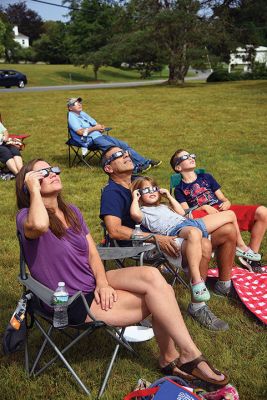 Partial Eclipse, Total Excitement 
The Plumb Library welcomed celestial spectators on Monday for the region’s partial eclipse of the sun, handing out free eclipse glasses. Photos by Glenn C. Silva
