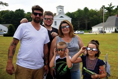 Partial Eclipse, Total Excitement 
The Plumb Library welcomed celestial spectators on Monday for the region’s partial eclipse of the sun, handing out free eclipse glasses. Photos by Glenn C. Silva
