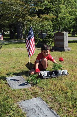 Marion Memorial Day
Jack LeFavor of Marion prepares a spot at one gravesite while James Whipple of Mattapoisett applies the finishing touches at another, as the two eight-year-old members of Marion Cub Scout Pack 32 help the Marion Department of Public Works plant flowers at all veterans’ graves in the Evergreen Cemetery on Saturday morning. The tradition, explained DPW representative Jody Dickerson, goes back to the Civil War. Evergreen is the largest of Marion’s five cemeteries. Photos by Mick Colageo
