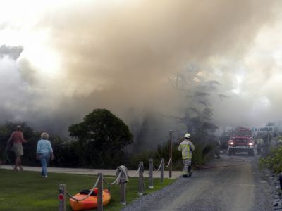 Bay Road Fire
The Mattapoisett Fire Department responded to a house fire on Bay Road at Point Connett around 7pm on Thursday July 22, 2010. The front of the structure was heavily damaged but the Fire Department was able to quickly contain the fire and keep it from spreading to neighboring homes. Photo by Paul Lopes
