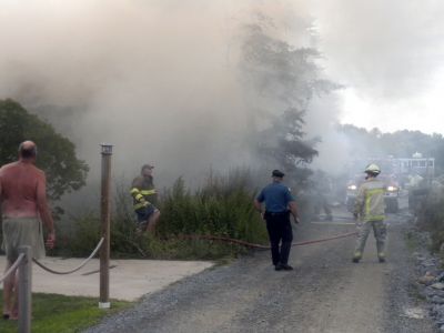 Bay Road Fire
The Mattapoisett Fire Department responded to a house fire on Bay Road at Point Connett around 7pm on Thursday July 22, 2010. The front of the structure was heavily damaged but the Fire Department was able to quickly contain the fire and keep it from spreading to neighboring homes. Photo by Paul Lopes
