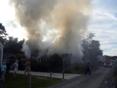 Bay Road Fire
The Mattapoisett Fire Department responded to a house fire on Bay Road at Point Connett around 7pm on Thursday July 22, 2010. The front of the structure was heavily damaged but the Fire Department was able to quickly contain the fire and keep it from spreading to neighboring homes. Photo by Paul Lopes
