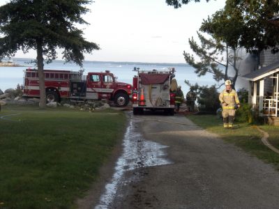 Bay Road Fire
The Mattapoisett Fire Department responded to a house fire on Bay Road at Point Connett around 7pm on Thursday July 22, 2010. The front of the structure was heavily damaged but the Fire Department was able to quickly contain the fire and keep it from spreading to neighboring homes. Photo by Paul Lopes
