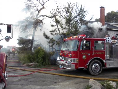 Bay Road Fire
The Mattapoisett Fire Department responded to a house fire on Bay Road at Point Connett around 7pm on Thursday July 22, 2010. The front of the structure was heavily damaged but the Fire Department was able to quickly contain the fire and keep it from spreading to neighboring homes. Photo by Paul Lopes
