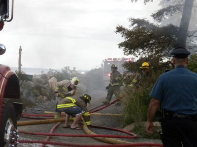 Bay Road Fire
The Mattapoisett Fire Department responded to a house fire on Bay Road at Point Connett around 7pm on Thursday July 22, 2010. The front of the structure was heavily damaged but the Fire Department was able to quickly contain the fire and keep it from spreading to neighboring homes. Photo by Paul Lopes
