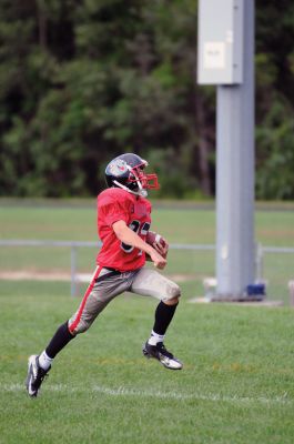 Youth Football 
Old Rochester Regional Bulldog Youth Football player Matthew Lanagan scores a touchdown in the fourth quarter of his game on Sunday, September 9.  Photos by Felix Perez. 
