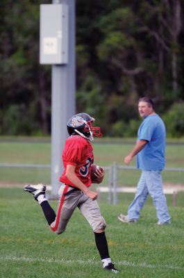 Youth Football 
Old Rochester Regional Bulldog Youth Football player Matthew Lanagan scores a touchdown in the fourth quarter of his game on Sunday, September 9.  Photos by Felix Perez. 
