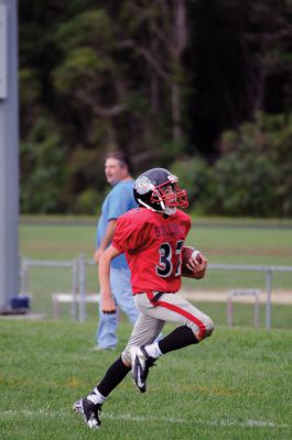 Youth Football 
Old Rochester Regional Bulldog Youth Football player Matthew Lanagan scores a touchdown in the fourth quarter of his game on Sunday, September 9.  Photos by Felix Perez. 
