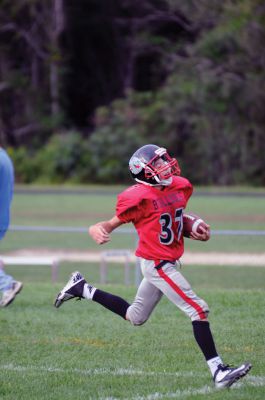 Youth Football 
Old Rochester Regional Bulldog Youth Football player Matthew Lanagan scores a touchdown in the fourth quarter of his game on Sunday, September 9.  Photos by Felix Perez. 
