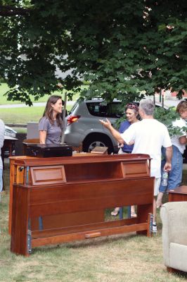 Summer Faire
Happy shoppers united at the Mattapoisett Congregational Churchs annual Summer Faire on July 31, 2010. The upscale yard sale offered great deals on nice furniture items and had a section of toys and games, just for the kids. Photo by Anne OBrien-Kakley.
