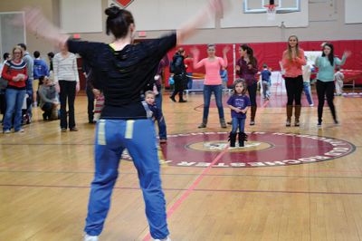 Strengthening Families Fair
There was so much to do and discover on March 1 at the “Strengthening Families Fair”, funded by the Department of Early Education & Care, and coordinated by the Old Rochester Regional School District. The gymnasium at the ORR High School was set up like a kids’ wonderland, with art projects, reading activities, brightly-colored gymnastics equipment, a flowing rainbow parachute, and…everyone’s favorite local children’s music group, “the Toe Jam Puppet Band.” Photo by Jean Perry
