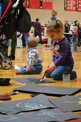 Strengthening Families Fair
There was so much to do and discover on March 1 at the “Strengthening Families Fair”, funded by the Department of Early Education & Care, and coordinated by the Old Rochester Regional School District. The gymnasium at the ORR High School was set up like a kids’ wonderland, with art projects, reading activities, brightly-colored gymnastics equipment, a flowing rainbow parachute, and…everyone’s favorite local children’s music group, “the Toe Jam Puppet Band.” Photo by Jean Perry
