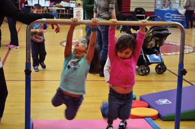 Strengthening Families Fair
There was so much to do and discover on March 1 at the “Strengthening Families Fair”, funded by the Department of Early Education & Care, and coordinated by the Old Rochester Regional School District. The gymnasium at the ORR High School was set up like a kids’ wonderland, with art projects, reading activities, brightly-colored gymnastics equipment, a flowing rainbow parachute, and…everyone’s favorite local children’s music group, “the Toe Jam Puppet Band.” Photo by Jean Perry
