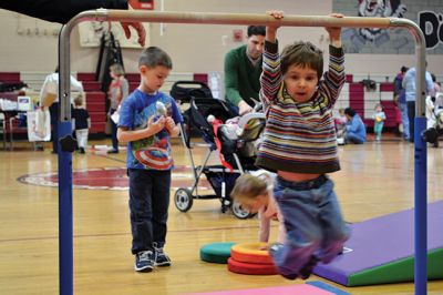 Strengthening Families Fair
There was so much to do and discover on March 1 at the “Strengthening Families Fair”, funded by the Department of Early Education & Care, and coordinated by the Old Rochester Regional School District. The gymnasium at the ORR High School was set up like a kids’ wonderland, with art projects, reading activities, brightly-colored gymnastics equipment, a flowing rainbow parachute, and…everyone’s favorite local children’s music group, “the Toe Jam Puppet Band.” Photo by Jean Perry
