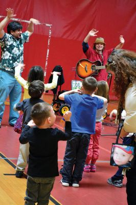 Strengthening Families Fair
There was so much to do and discover on March 1 at the “Strengthening Families Fair”, funded by the Department of Early Education & Care, and coordinated by the Old Rochester Regional School District. The gymnasium at the ORR High School was set up like a kids’ wonderland, with art projects, reading activities, brightly-colored gymnastics equipment, a flowing rainbow parachute, and…everyone’s favorite local children’s music group, “the Toe Jam Puppet Band.” Photo by Jean Perry
