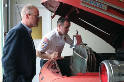 Historic Engine
The Dunn family of Mattapoisett is donating their iconic Maxim Motors Company 1949 fire engine to the Mattapoisett Rescue Association as of October 2011. From left to right: Mattapoisett Fire Chief Andrew Murray, Gail Dunn and David Dunn. The engine will remain at its current location at 55 County Road, Mattapoisett. Photo by Anne Kakley.
