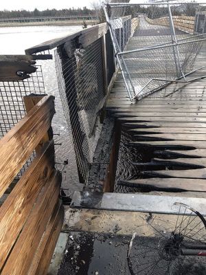 Bridge Fire
A section of the bike-path bridge near the currently closed entrance at Mattapoisett Neck Road sustained  significant damage from an April 2 fire extinguished by the Mattapoisett Fire Department. Mattapoisett Police took a person of interest into custody, and the incident remains under investigation. Photos courtesy of the Town of Mattapoisett
