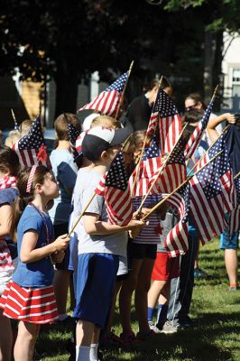 Flag Day
Center School students gathered together with Old Hammondtown students by the Center School flagpole on the morning of Tuesday, June 14, to celebrate Flag Day. The OHS band played a number of tunes, while the Center School students sang patriotic songs and listened to Principal Rose Bowman read a series of poems and writings to remind the children of what the American flag stands for. Afterwards, the third-graders treated the seniors to the school’s annual senior breakfast. Photos by Jean Perry
