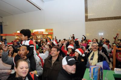 Flash Mob
Mattapoisett native and Old Rochester Regional graduate Chad Michael Peters coordinated a "flash mob" on December 16. The mob of over 200 carolers, including many Tri-Town residents, convened at the Dartmouth Mall to surprise shoppers with a medley of three holiday classics: "Deck the Halls", "Silent Night" and "Jingle Bells". Just as soon as the mob showed up, it dispersed. Photo by Felix Perez.
