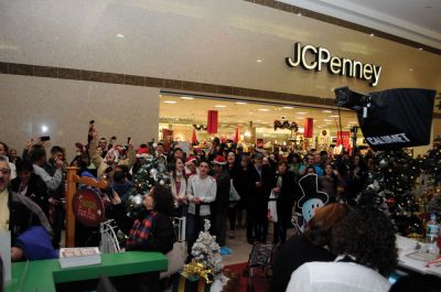 Flash Mob
Mattapoisett native and Old Rochester Regional graduate Chad Michael Peters coordinated a "flash mob" on December 16. The mob of over 200 carolers, including many Tri-Town residents, convened at the Dartmouth Mall to surprise shoppers with a medley of three holiday classics: "Deck the Halls", "Silent Night" and "Jingle Bells". Just as soon as the mob showed up, it dispersed. Photo by Felix Perez.
