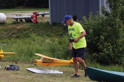 Bristol County Radio Control “RC” Club
Radio control model seaplanes are more than just a hobby for members of the Bristol County Radio Control “RC” Club. As club member Gerry Dupont puts it, “It’s an affliction. A happy affliction.” Dupont’s yellow Piper Cub seaplane features a one-fifth-scale pilot named “Gus” who’s been flying the one-fifth-scale seaplane for seven years. Photos by Jean Perry
