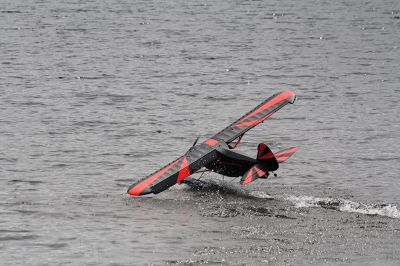 Bristol County Radio Control “RC” Club
Radio control model seaplanes are more than just a hobby for members of the Bristol County Radio Control “RC” Club. As club member Gerry Dupont puts it, “It’s an affliction. A happy affliction.” Dupont’s yellow Piper Cub seaplane features a one-fifth-scale pilot named “Gus” who’s been flying the one-fifth-scale seaplane for seven years. Photos by Jean Perry
