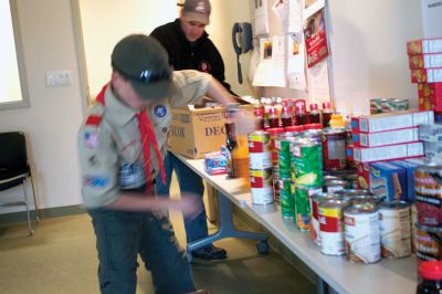 Holiday Food Drive
 Boy Scouts of Troop 32 in Marion celebrate during the last day of their food drive at the Marion Police Department.  The scouts collected over 200 items of non-perishable food for The Family Pantry- Damien’s Place in East Wareham.  Photo by Eric Tripoli.
