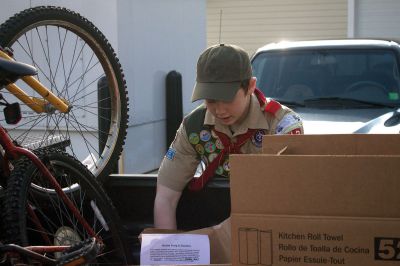 Holiday Food Drive
 Boy Scouts of Troop 32 in Marion celebrate during the last day of their food drive at the Marion Police Department.  The scouts collected over 200 items of non-perishable food for The Family Pantry- Damien’s Place in East Wareham.  Photo by Eric Tripoli.
