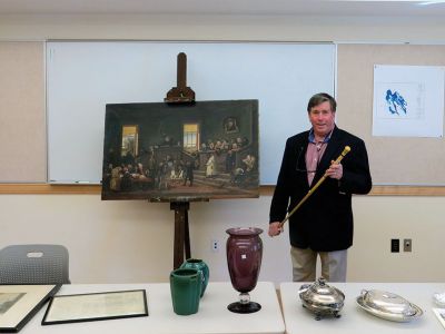 Frank McNamee
Frank McNamee gave a talk on May 1 to the Marion Council on Aging entitled, “What’s in Your Attic?” at the Marion Police Station.  He discussed many of the important objects that he discovered in attics of local homes and how much they were worth. He also appraised objects brought in by Council on Aging members as well as discussing the values of objects he brought in from his antiques shop. The speech was taped by the local cable station, ORCTV, channel 9 for Comcast, channel 36 for Verizon subscribers.
