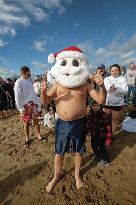 “Freezin’ for a Reason” 
Every year hundreds make waves on New Year’s Day at the Mattapoisett Town Beach for the annual “Freezin’ for a Reason” polar plunge. With the support of local businesses and emergency responders, the event has continued every year, raising thousands of dollars to help local families facing cancer treatment. Photos by Felix Perez
