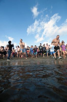 “Freezin’ for a Reason” 
Every year hundreds make waves on New Year’s Day at the Mattapoisett Town Beach for the annual “Freezin’ for a Reason” polar plunge. With the support of local businesses and emergency responders, the event has continued every year, raising thousands of dollars to help local families facing cancer treatment. Photos by Felix Perez
