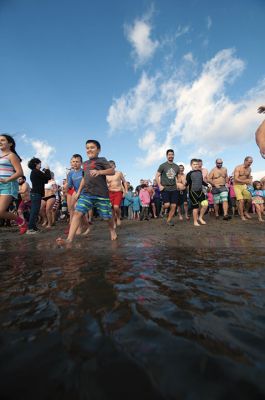 “Freezin’ for a Reason” 
Every year hundreds make waves on New Year’s Day at the Mattapoisett Town Beach for the annual “Freezin’ for a Reason” polar plunge. With the support of local businesses and emergency responders, the event has continued every year, raising thousands of dollars to help local families facing cancer treatment. Photos by Felix Perez
