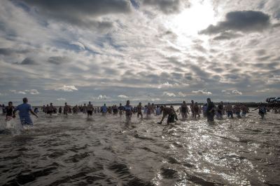 “Freezin’ for a Reason” 
Every year hundreds make waves on New Year’s Day at the Mattapoisett Town Beach for the annual “Freezin’ for a Reason” polar plunge. With the support of local businesses and emergency responders, the event has continued every year, raising thousands of dollars to help local families facing cancer treatment. Photos by Felix Perez
