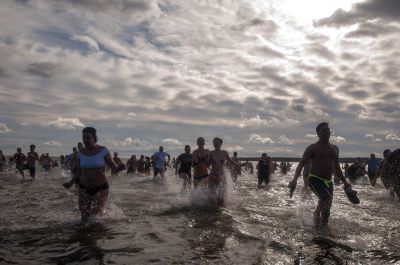 “Freezin’ for a Reason” 
Every year hundreds make waves on New Year’s Day at the Mattapoisett Town Beach for the annual “Freezin’ for a Reason” polar plunge. With the support of local businesses and emergency responders, the event has continued every year, raising thousands of dollars to help local families facing cancer treatment. Photos by Felix Perez

