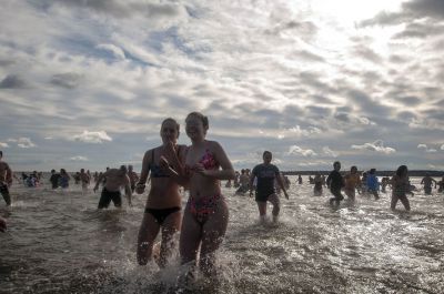 “Freezin’ for a Reason” 
Every year hundreds make waves on New Year’s Day at the Mattapoisett Town Beach for the annual “Freezin’ for a Reason” polar plunge. With the support of local businesses and emergency responders, the event has continued every year, raising thousands of dollars to help local families facing cancer treatment. Photos by Felix Perez
