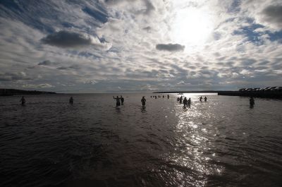 “Freezin’ for a Reason” 
Every year hundreds make waves on New Year’s Day at the Mattapoisett Town Beach for the annual “Freezin’ for a Reason” polar plunge. With the support of local businesses and emergency responders, the event has continued every year, raising thousands of dollars to help local families facing cancer treatment. Photos by Felix Perez
