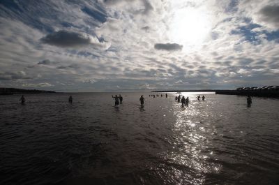 “Freezin’ for a Reason” 
Every year hundreds make waves on New Year’s Day at the Mattapoisett Town Beach for the annual “Freezin’ for a Reason” polar plunge. With the support of local businesses and emergency responders, the event has continued every year, raising thousands of dollars to help local families facing cancer treatment. Photos by Felix Perez
