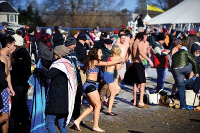 Freezin’ for a Reason
January 1 found locals Freezin’ for a Reason again at the annual polar plunge fundraiser to benefit those who are fighting cancer in our own community. At Mattapoisett Town Beach that morning, the air temperature was in the single digits and the water was a frigid 40 degrees. Photos by Glenn C. Silva
