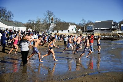 Freezin’ for a Reason
January 1 found locals Freezin’ for a Reason again at the annual polar plunge fundraiser to benefit those who are fighting cancer in our own community. At Mattapoisett Town Beach that morning, the air temperature was in the single digits and the water was a frigid 40 degrees. Photos by Glenn C. Silva
