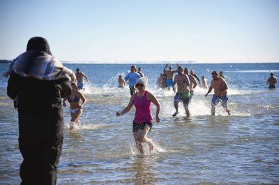 Freezin’ for a Reason
January 1 found locals Freezin’ for a Reason again at the annual polar plunge fundraiser to benefit those who are fighting cancer in our own community. At Mattapoisett Town Beach that morning, the air temperature was in the single digits and the water was a frigid 40 degrees. Photos by Glenn C. Silva
