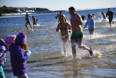 Freezin’ for a Reason
January 1 found locals Freezin’ for a Reason again at the annual polar plunge fundraiser to benefit those who are fighting cancer in our own community. At Mattapoisett Town Beach that morning, the air temperature was in the single digits and the water was a frigid 40 degrees. Photos by Glenn C. Silva
