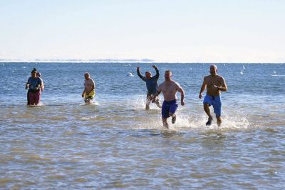 Freezin’ for a Reason
January 1 found locals Freezin’ for a Reason again at the annual polar plunge fundraiser to benefit those who are fighting cancer in our own community. At Mattapoisett Town Beach that morning, the air temperature was in the single digits and the water was a frigid 40 degrees. Photos by Glenn C. Silva
