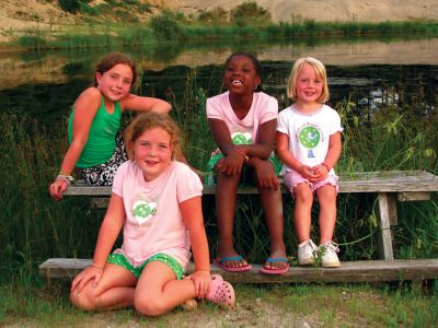 Fresh Air
The Hartley family of Rochester was among the winners of The Fresh Air Funds 2010 Photo Contest. The Hartleys photo was determined the winner in the Family Portrait category, and features Fresh Air visitor Jasmine surrounded by her Fresh Air sisters, Madeline, Callie and Eva. Photo courtesy of Kaitlin Caruso.
