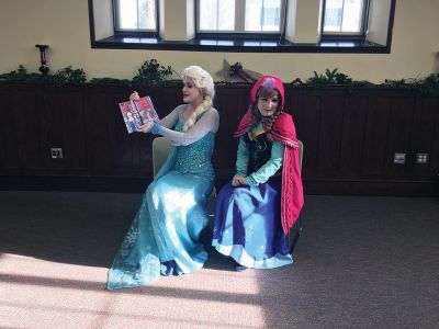 Frozen Princesses
On December 21, two princesses visited the Mattapoisett Public Library to read stories and sing songs from the Disney film Frozen. Princesses Elsa and Anna beguiled the children as well as their parents in an hour-long performance culminating in hugs and a photo session. The delightful event was sponsored by the Friends of the Mattapoisett Library. Photos by Marilou Newell
