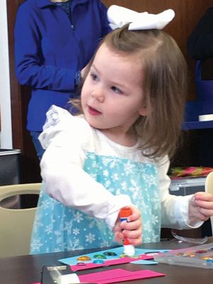 Frozen Princesses
On December 21, two princesses visited the Mattapoisett Public Library to read stories and sing songs from the Disney film Frozen. Princesses Elsa and Anna beguiled the children as well as their parents in an hour-long performance culminating in hugs and a photo session. The delightful event was sponsored by the Friends of the Mattapoisett Library. Photos by Marilou Newell
