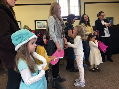 Frozen Princesses
On December 21, two princesses visited the Mattapoisett Public Library to read stories and sing songs from the Disney film Frozen. Princesses Elsa and Anna beguiled the children as well as their parents in an hour-long performance culminating in hugs and a photo session. The delightful event was sponsored by the Friends of the Mattapoisett Library. Photos by Marilou Newell
