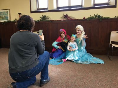 Frozen Princesses
On December 21, two princesses visited the Mattapoisett Public Library to read stories and sing songs from the Disney film Frozen. Princesses Elsa and Anna beguiled the children as well as their parents in an hour-long performance culminating in hugs and a photo session. The delightful event was sponsored by the Friends of the Mattapoisett Library. Photos by Marilou Newell
