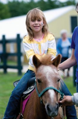 Grandparents Day
The South Coast Senior Resource Alliance (SRA) sponsored a Grandparents Day in Rochester on September 12, 2010. The day celebrated the bond between grandparent and grandchild with pony rides, face-painting and lots of games. SRA volunteers also provided valuable health and wellness information to the seniors who attended. Photos by Felix Perez.
