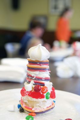 Gingerbread Houses
While others were out bustling on the last Saturday before Christmas, a couple dozen of the littler library patrons enjoyed the day making candy gingerbread houses at the Mattapoisett Free Public Library on Saturday, December 19.
